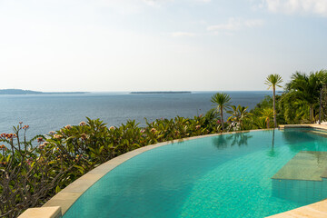 Luxury hotel infinity pool in summer