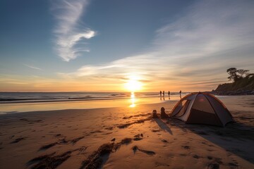 Fototapeta na wymiar Tent camping on the beach at sunrise