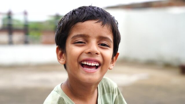 Portrait of a happy laughing child boy. Close-up portrait of him he nice-looking attractive lovely healthy glad cheerful cheery foxy ginger boy enjoying good mood.