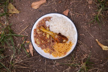 Merienda de la Chakra with chicken, rice and legumes. Traditional dish of the people who work in the fields of the Peruvian jungle.