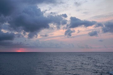 Sunset over the mediterranean sea on a cloudy day