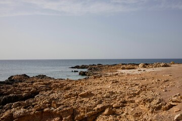 Scenic view of a tranquil beach against the sea on a sunny day