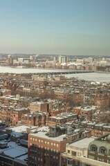 Fototapeta na wymiar Bostons back bay neighborhood in the winter with the Charles river frozen