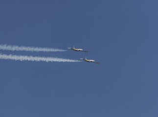 Vintage fighter jets flying on a demonstration during an airshow in San Francisco