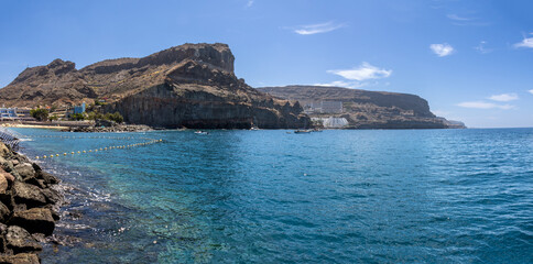 Puerto de Mog&aacute;n, coastal town that has its back covered by a rocky and dark hill that reaches the sea, while in front it enjoys the best views of the Atlantic Ocean, Gran Canaria, Spain