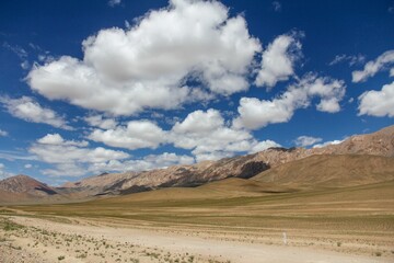 Aerial view of desert surrounded by mountains