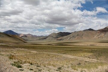 Fototapeta premium Aerial view of desert surrounded by mountains