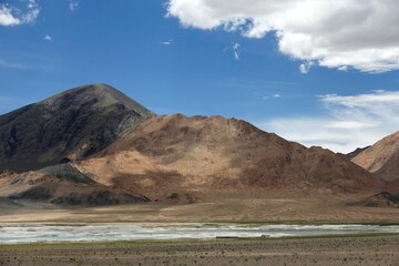 Aerial view of lake surrounded by mountains