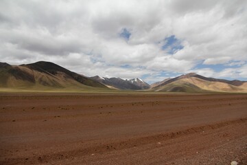 Aerial view of desert surrounded by mountains