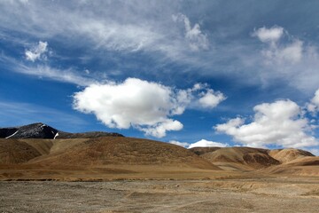 Aerial view of desert surrounded by mountains