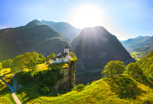 Panoramic aerial view of San Martino Church in Calonico during summer day, Leventina, Switzerland