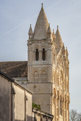 Fototapeta na wymiar Angouleme cathedral side view, 12th century Romanesque style with a sculpted facade