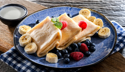 Home-made Polish pancakes filled with sweet cottage cheese