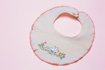 Baby bib handmade on pink  background - 619050218