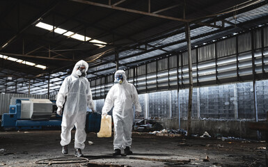 Workers wear protection suit checking chemical in old factory. Protecting Against Hazards and Contamination. Emergency Response to a Radioactive Accident. - obrazy, fototapety, plakaty