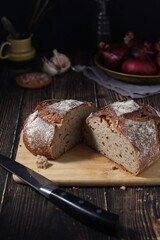 A loaf of rye bread in low key