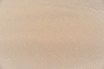 Fototapeta na wymiar softness sand background textured desert area on a sunny day, clean and empty beach for outdoor summer activity
