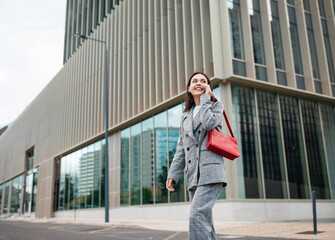 Business Lady Talking On Phone While Walking In City Outdoor