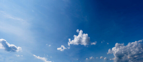White clouds over the mountains, fluffy clouds, panorama 