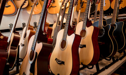 Many rows of classical guitars in the music shop