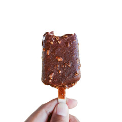 Delicious chocolate and almond-coated ice cream skewers on a wooden stick and held with left hand isolated on transparent cut-out background.