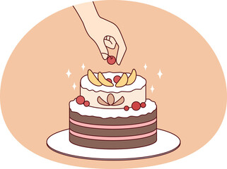 Person decorate cake with fruit