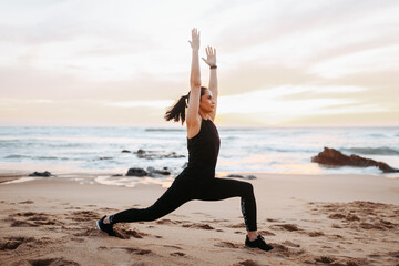 Fototapeta na wymiar Serious senior caucasian lady in sportswear enjoy workout, doing stretching body, practice yoga