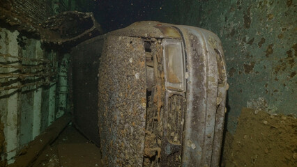 Car lying inside cramped hold of ferry Salem Express shipwreck, Red sea, Safaga, Egypt