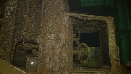 Close-up of truck cab lying on its side inside hold of ferry Salem Express shipwreck, Red sea, Safaga, Egypt