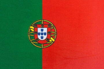 the national flag of Portugal on a fabric basis close-up