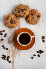 Coffee served with chocolate biscuits , autumn composition