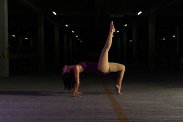 Beautiful contemporary dancer doing a performance at night