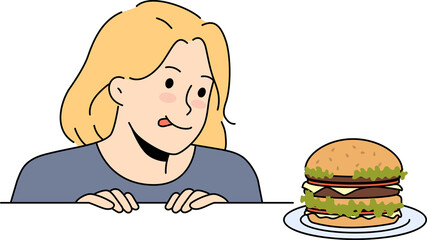 Excited child look at delicious burger on table