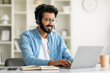 Hotline Operator. Indian Customer Support Manager Man In Headset Working With Laptop