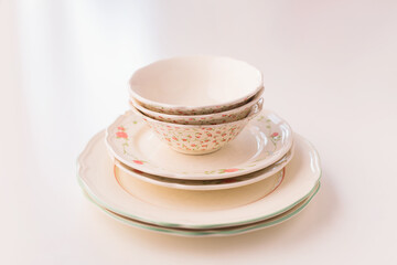 Closeup of porcelain plates and bowls