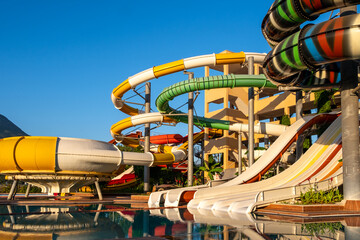 Empty Water park for kids in a luxury hotel near the sea. Water park, bright multi-colored slides...