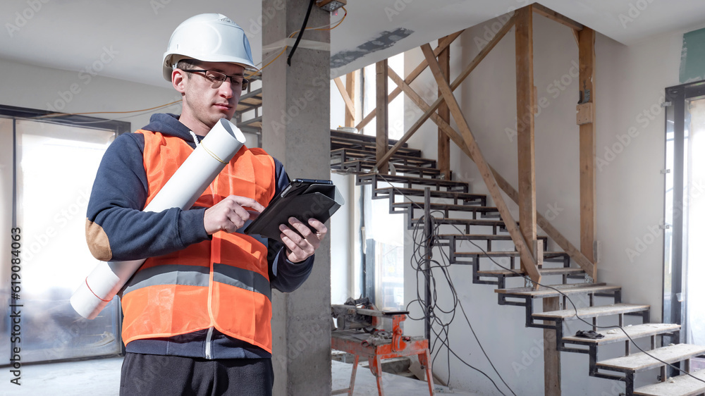 Aufkleber foreman with tablet. man builder. worker in house under construction. builder with roll of architect