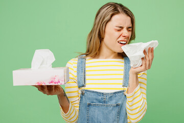 Sick ill allergic sad woman has watery eyes runny stuffy sore nose suffering from allergy trigger...