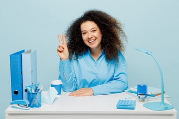 Young happy cheerful successful employee business woman wear casual shirt sit work at white office...