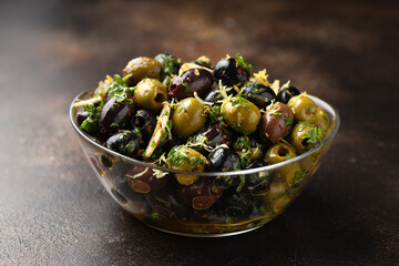 Marinated olives with fresh herbs, garlic, red wine vinegar and lemon zest