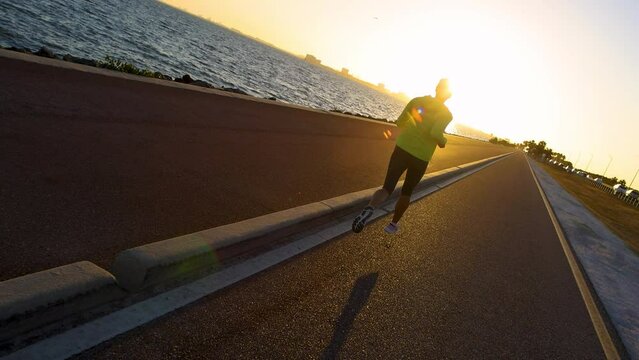POV Fitness female exercising outdoors at sunrise USA