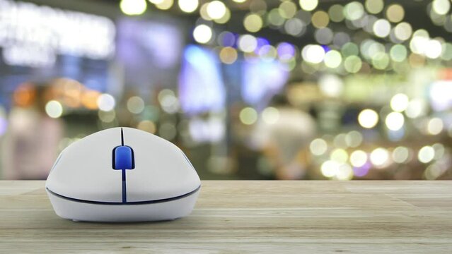 Airplane with shield flat icon with wireless computer mouse on wooden table over blur light and shadow of shopping mall, Business travel insurance and safety online concept