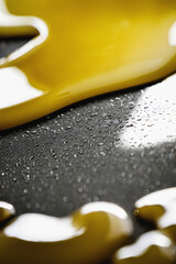 Gold abstract liquid, colorful fantasy background with yellow slime and small particles