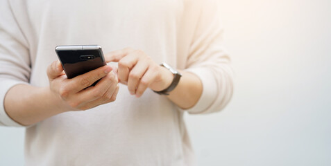 close up businessman hold smartphone to checking application or read news on online website in relax time for lifestyle business concept