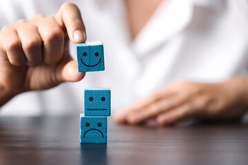 Business Success and Customer Satisfaction Concept: Wooden Cube of Achievement, Innovation, and...