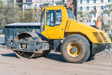 Road roller for road construction. Asphalt concrete roller for compaction of soil and foundations in road construction. Equipment for road works. Road construction.