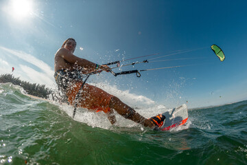 A kite surfer rides the waves