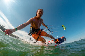 A kite surfer rides the waves