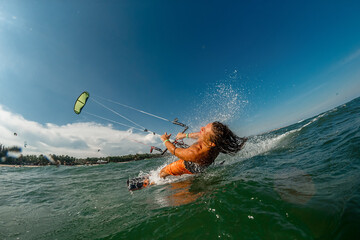 A kite surfer rides the waves