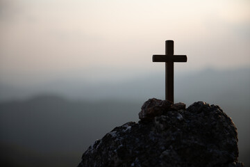 Crucifixion Of Jesus Christ - Cross At Sunset. Silhouette cross on Calvary mountain sunset...